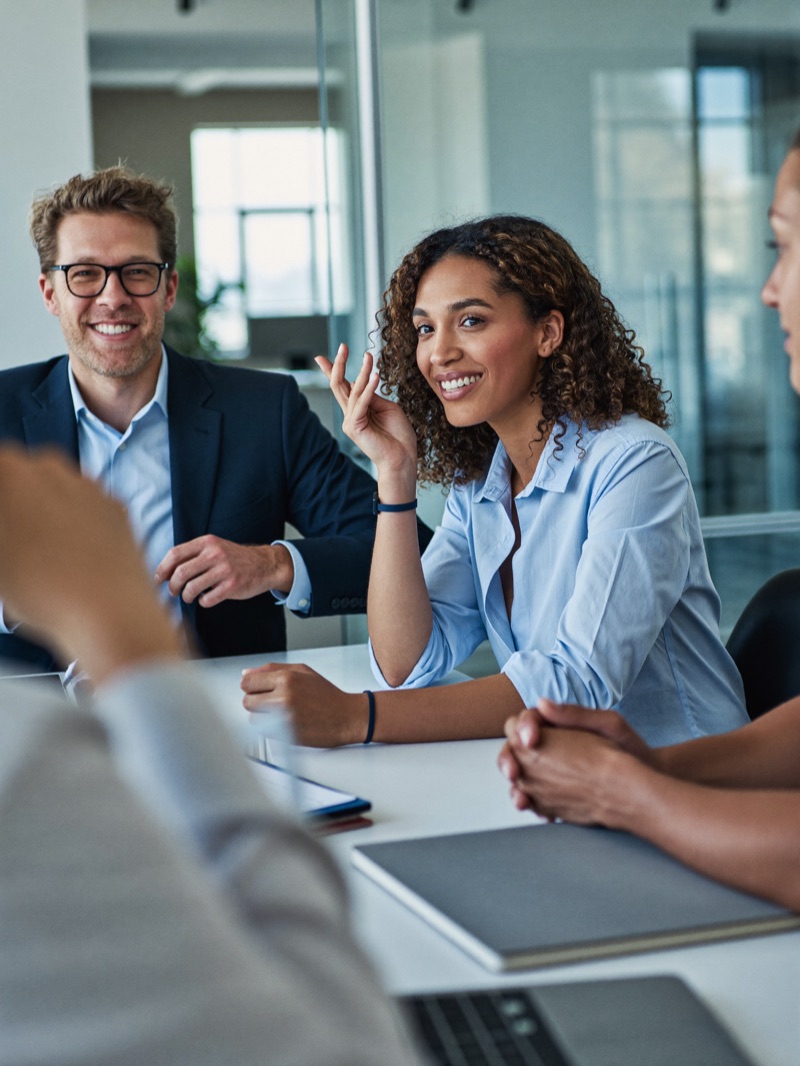 Colleagues in discussion around a meeting table